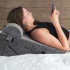 a woman lying on a pillow